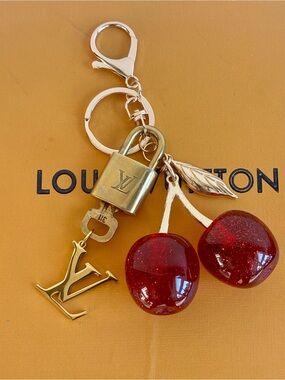 AUTHENTIC LOUIS VUITTON
BRASS LOCK & KEY #311, LARGE RED CHERRY BAG CHARM, 6 in